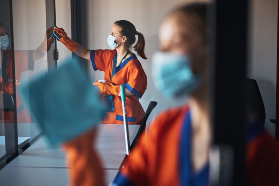 Two people cleaning window